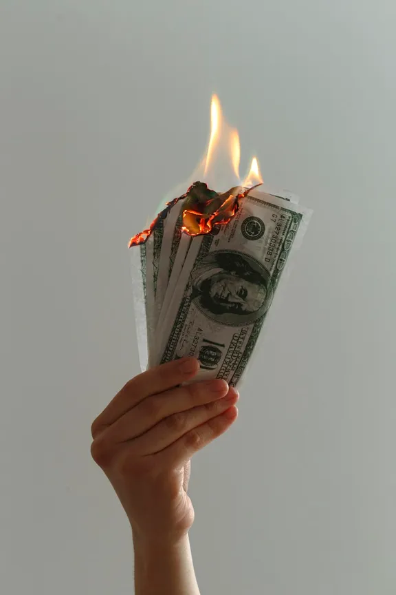Hundred-dollar bills burning